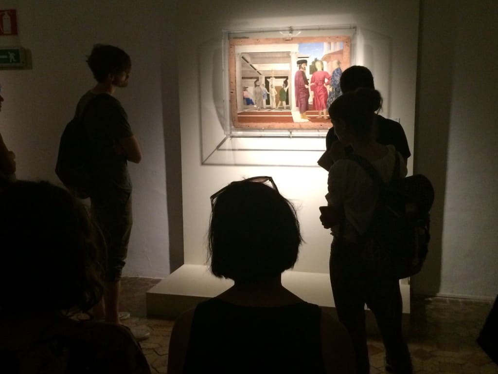 JSS students looking at The Flagellation of Christ, by Piero della Francesca